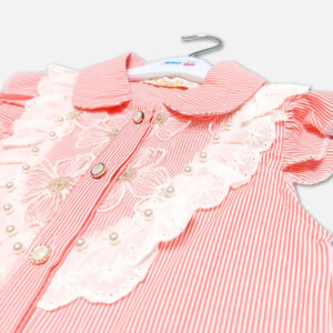 A premium two-piece summer outfit for baby girls featuring a peach and white pinstriped button-down blouse with an embroidered lace bib and tie-front knot, paired with a pleated navy blue skirt accented with metallic pink stripes and a gold belt, shown on a white hanger.