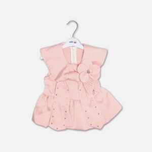 A premium two-piece formal outfit for baby girls featuring a sleeveless soft pink satin peplum top with a structured collar, scattered rhinestones, and a fabric flower brooch, paired with cream-colored shorts with rhinestone accents and a pink ribbon waist tie, displayed on a white hanger.