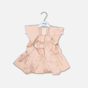 A premium two-piece formal clothing set for baby girls featuring a sleeveless peach-colored satin peplum top with a structured collar, rhinestone embellishments, and a fabric flower brooch, paired with beige shorts featuring rhinestone accents and a matching peach ribbon waist tie, displayed on a white hanger.