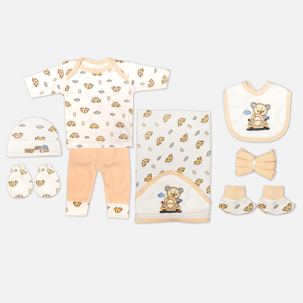11-1 Mini & Me 7-piece light yellow and cream newborn baby layette set featuring car print and teddy bear driver illustration including top, pants, hooded blanket, bib, cap, mittens, and booties