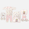 Mini & Me 7-piece soft pink and white newborn baby girl layette set featuring car print and teddy bear driver illustration including top, pants, hooded blanket, bib, cap, mittens, and booties