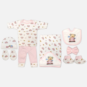 Mini & Me 7-piece soft pink and white newborn baby girl layette set featuring car print and teddy bear driver illustration including top, pants, hooded blanket, bib, cap, mittens, and booties